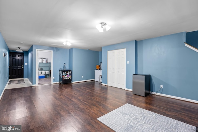 interior space with dark hardwood / wood-style flooring