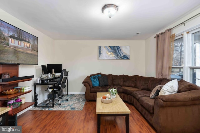 office space with baseboards and wood finished floors