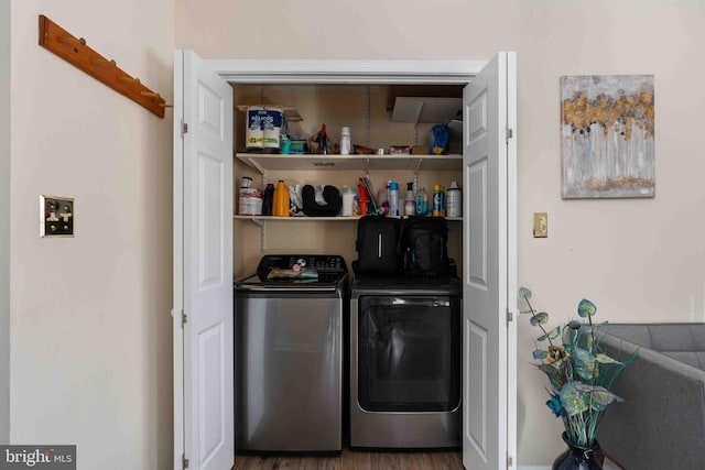 clothes washing area with laundry area, dark wood finished floors, and independent washer and dryer