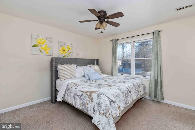 bedroom featuring baseboards, visible vents, and carpet flooring