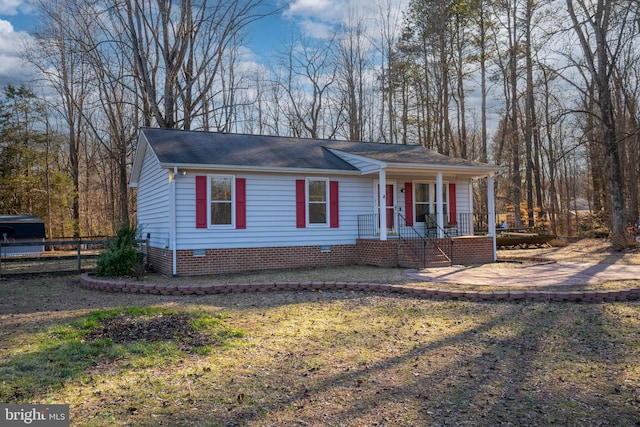 view of front of house with crawl space and fence