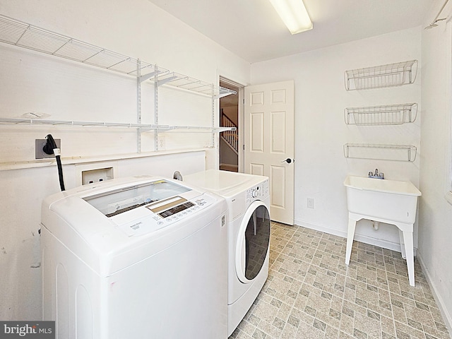 washroom with washer and dryer