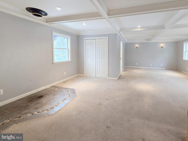 unfurnished bedroom with carpet, coffered ceiling, ornamental molding, and beam ceiling