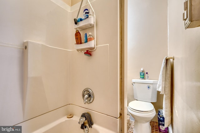 bathroom featuring toilet, tile patterned flooring, and shower / bathtub combination