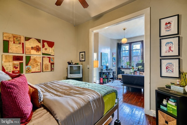 bedroom featuring ceiling fan and dark hardwood / wood-style floors