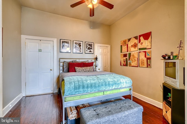 bedroom featuring ceiling fan and dark wood-type flooring