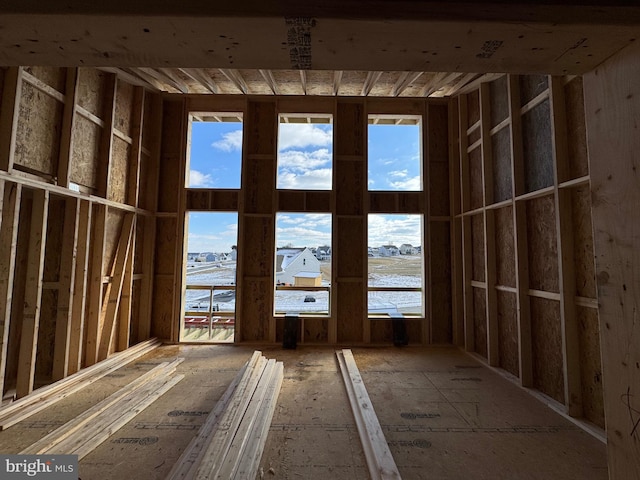 miscellaneous room with a water view and plenty of natural light