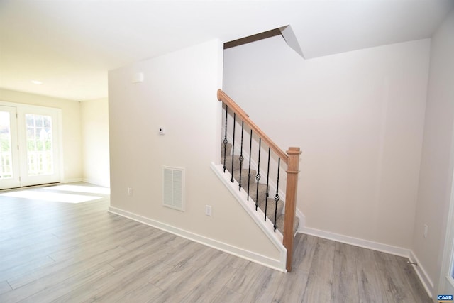 stairway with wood-type flooring