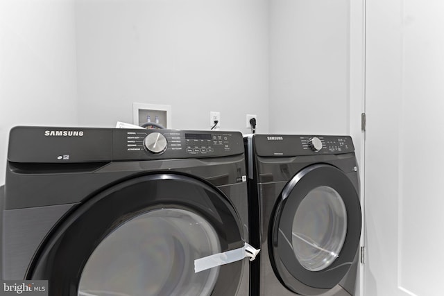 laundry room featuring washing machine and dryer