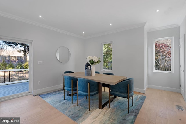 dining space with recessed lighting, visible vents, ornamental molding, light wood-type flooring, and baseboards