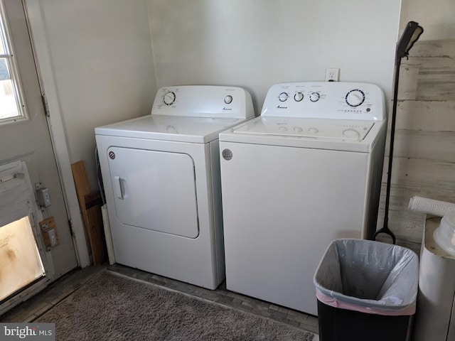 clothes washing area with laundry area and separate washer and dryer