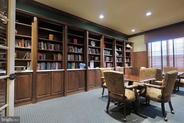 interior space with light carpet, a wainscoted wall, recessed lighting, and crown molding