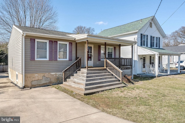 view of front of home with a front lawn and a porch