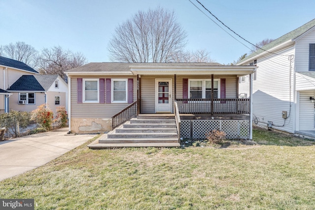 view of front facade with covered porch and a front yard