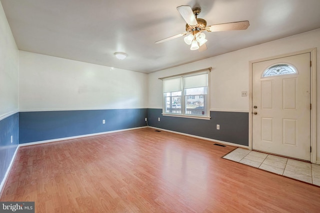 entrance foyer with ceiling fan and light hardwood / wood-style floors