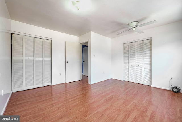 unfurnished bedroom featuring ceiling fan and wood-type flooring