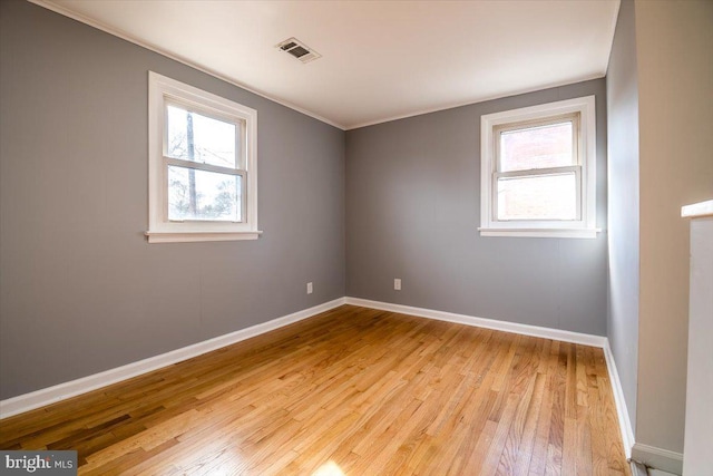 unfurnished room featuring light wood-type flooring