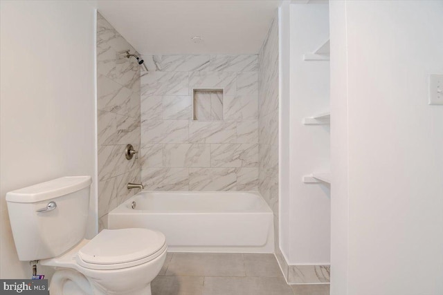 bathroom with toilet, tile patterned flooring, and tiled shower / bath combo