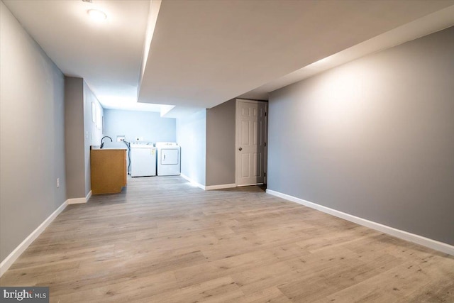 interior space with independent washer and dryer and light wood-type flooring