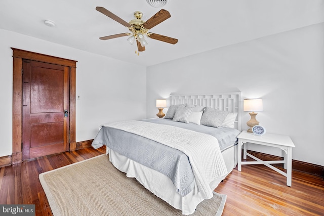 2902 Shirey Ave, Baltimore, MD 21214 - bedroom with baseboards, wood finished floors, and a ceiling fan