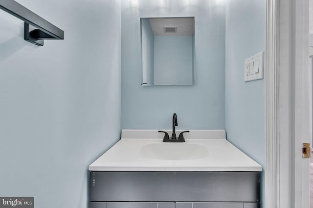 bathroom featuring visible vents and vanity