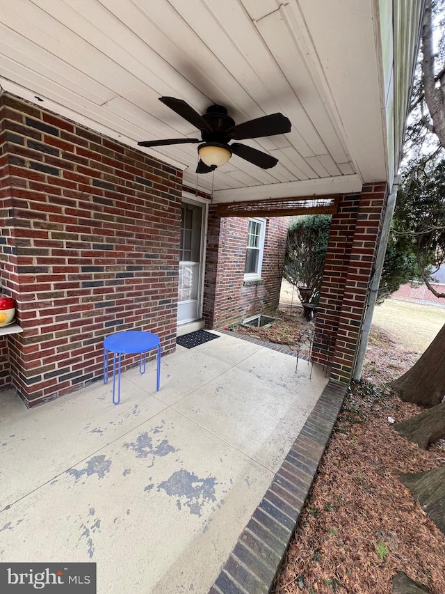 view of patio featuring ceiling fan