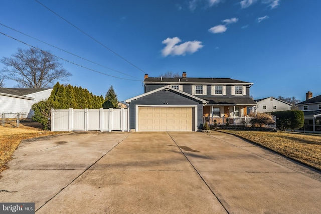 traditional-style home featuring solar panels, covered porch, fence, a garage, and driveway