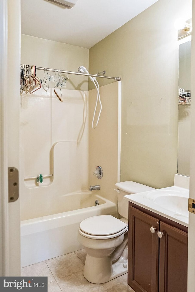 bathroom with  shower combination, tile patterned flooring, vanity, and toilet