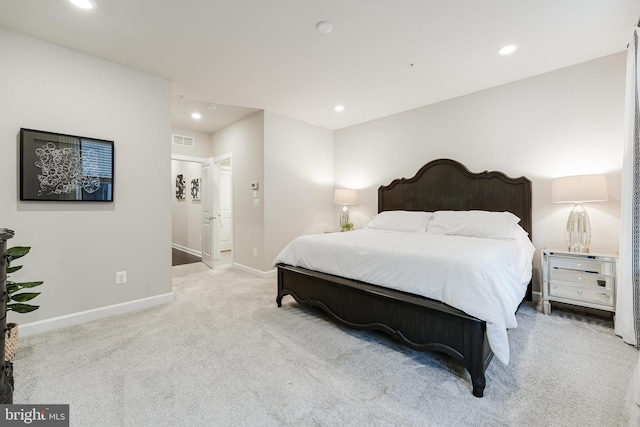 bedroom with visible vents, baseboards, light colored carpet, and recessed lighting