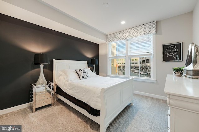 bedroom with light carpet, baseboards, and recessed lighting