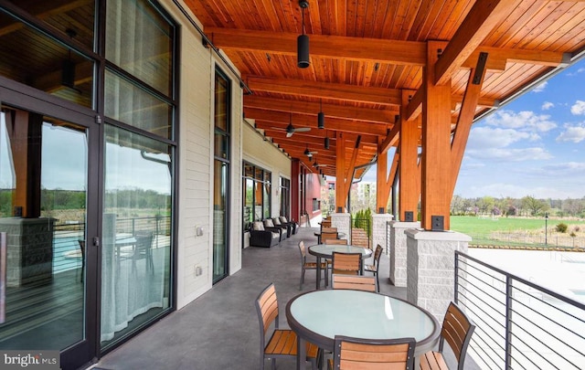 balcony with a ceiling fan and outdoor dining space