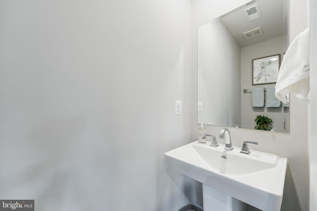 bathroom with a sink and visible vents