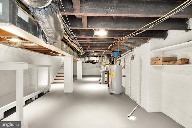 unfinished basement with water heater and stairway