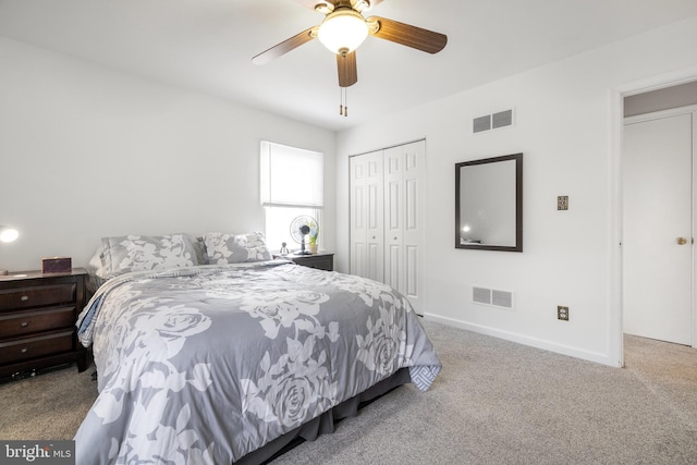 carpeted bedroom with a closet and ceiling fan