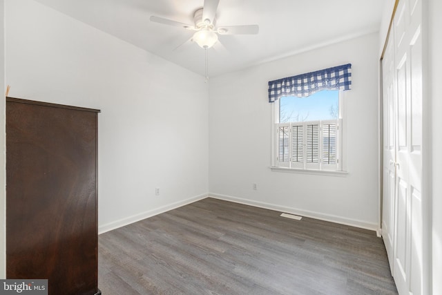 unfurnished bedroom with hardwood / wood-style flooring and ceiling fan