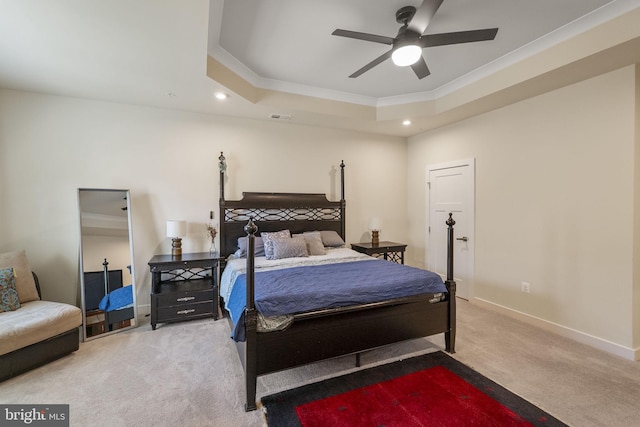 carpeted bedroom featuring visible vents, baseboards, ornamental molding, a tray ceiling, and recessed lighting