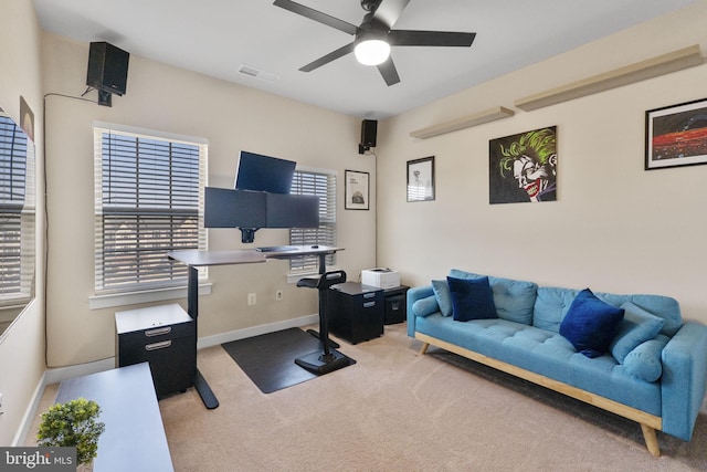 carpeted living area with ceiling fan, visible vents, and baseboards