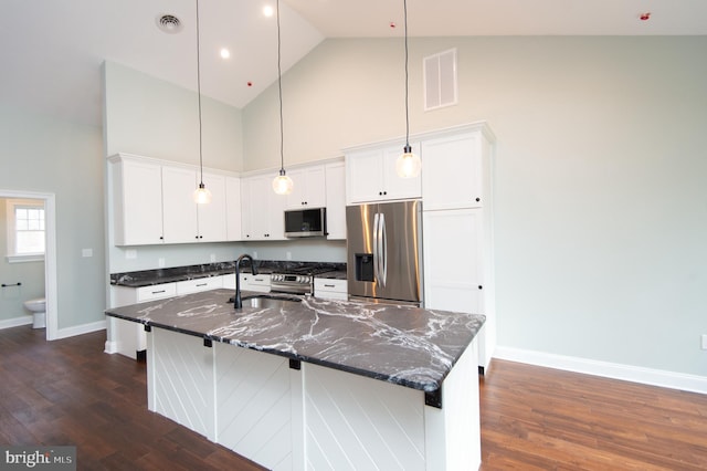 kitchen with white cabinetry, visible vents, appliances with stainless steel finishes, and pendant lighting