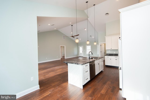 kitchen with a kitchen island with sink, a sink, stainless steel dishwasher, and white cabinetry