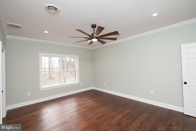 empty room featuring dark wood-type flooring, visible vents, and baseboards