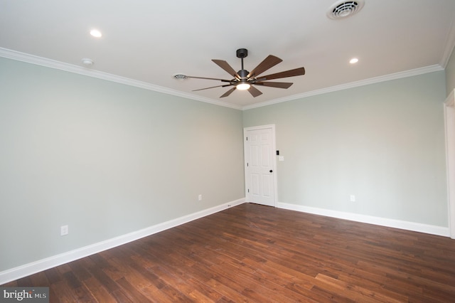 unfurnished room featuring ornamental molding, dark wood finished floors, visible vents, and baseboards