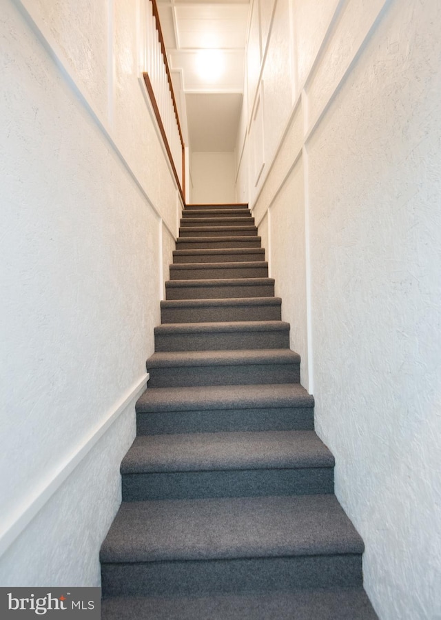 stairs with a textured wall