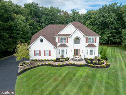 colonial home with a front yard