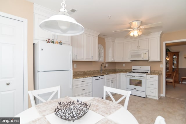 kitchen featuring white appliances, white cabinetry, sink, and pendant lighting