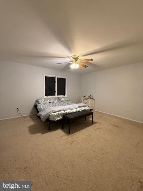 bedroom featuring carpet, a ceiling fan, and baseboards