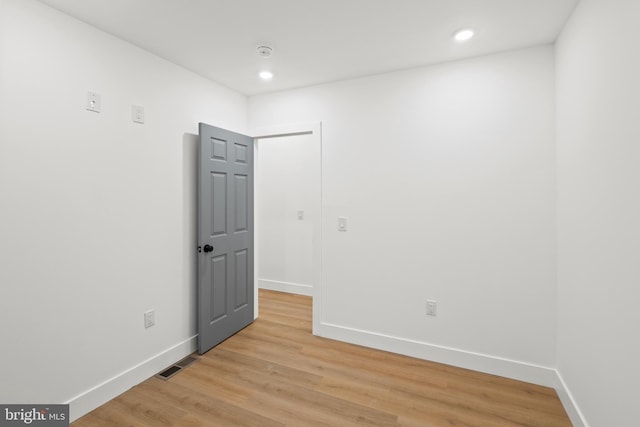 empty room with light wood-type flooring