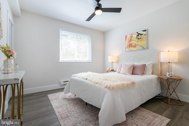 bedroom featuring ceiling fan, baseboards, and dark wood-type flooring