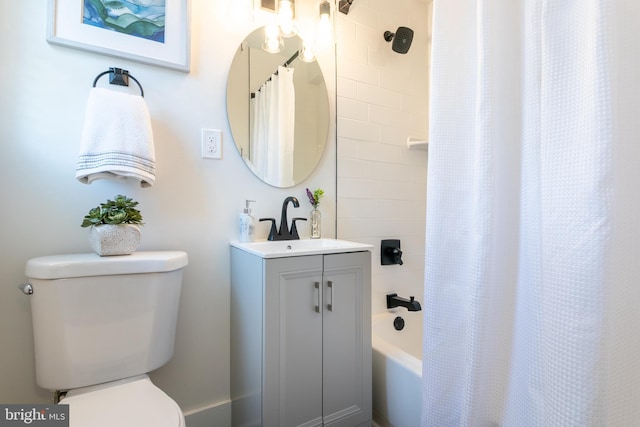 bathroom featuring shower / tub combo, vanity, and toilet