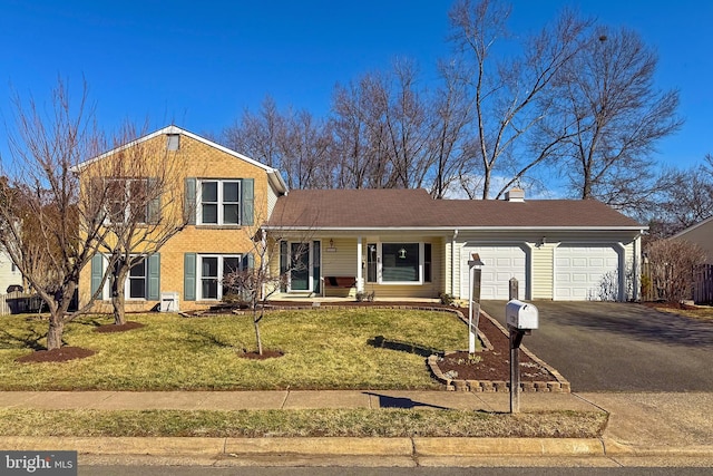 view of front of property featuring an attached garage, brick siding, driveway, a front lawn, and a chimney