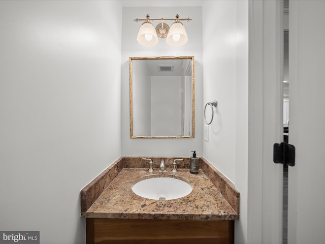 bathroom with visible vents and vanity